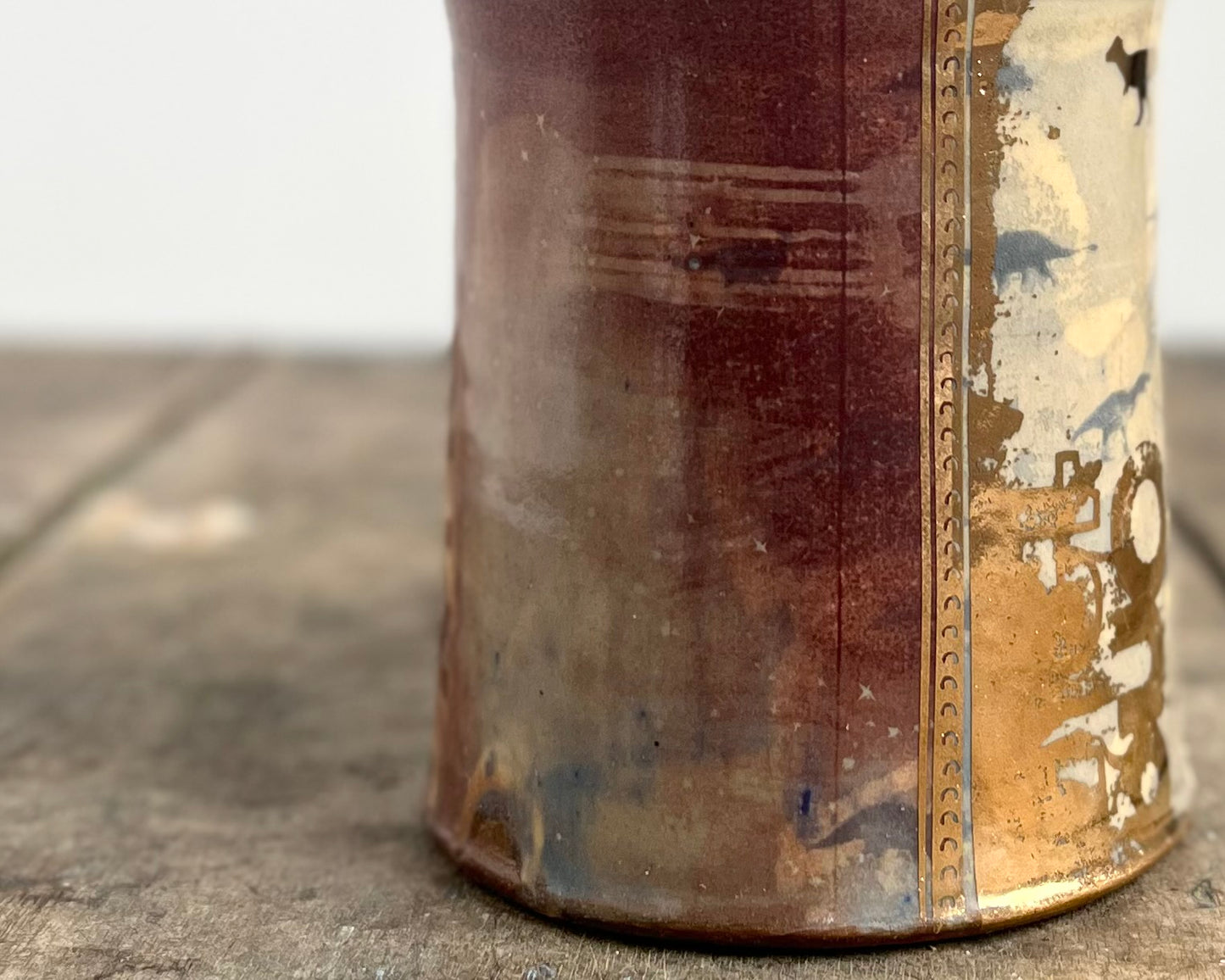 Mug with slip, gold decals and image transfer