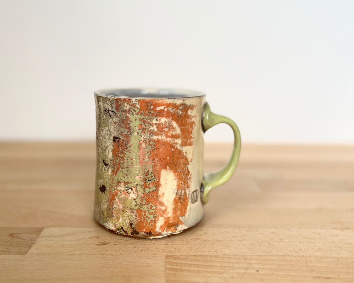 Mug with slip, gold decals and image transfer