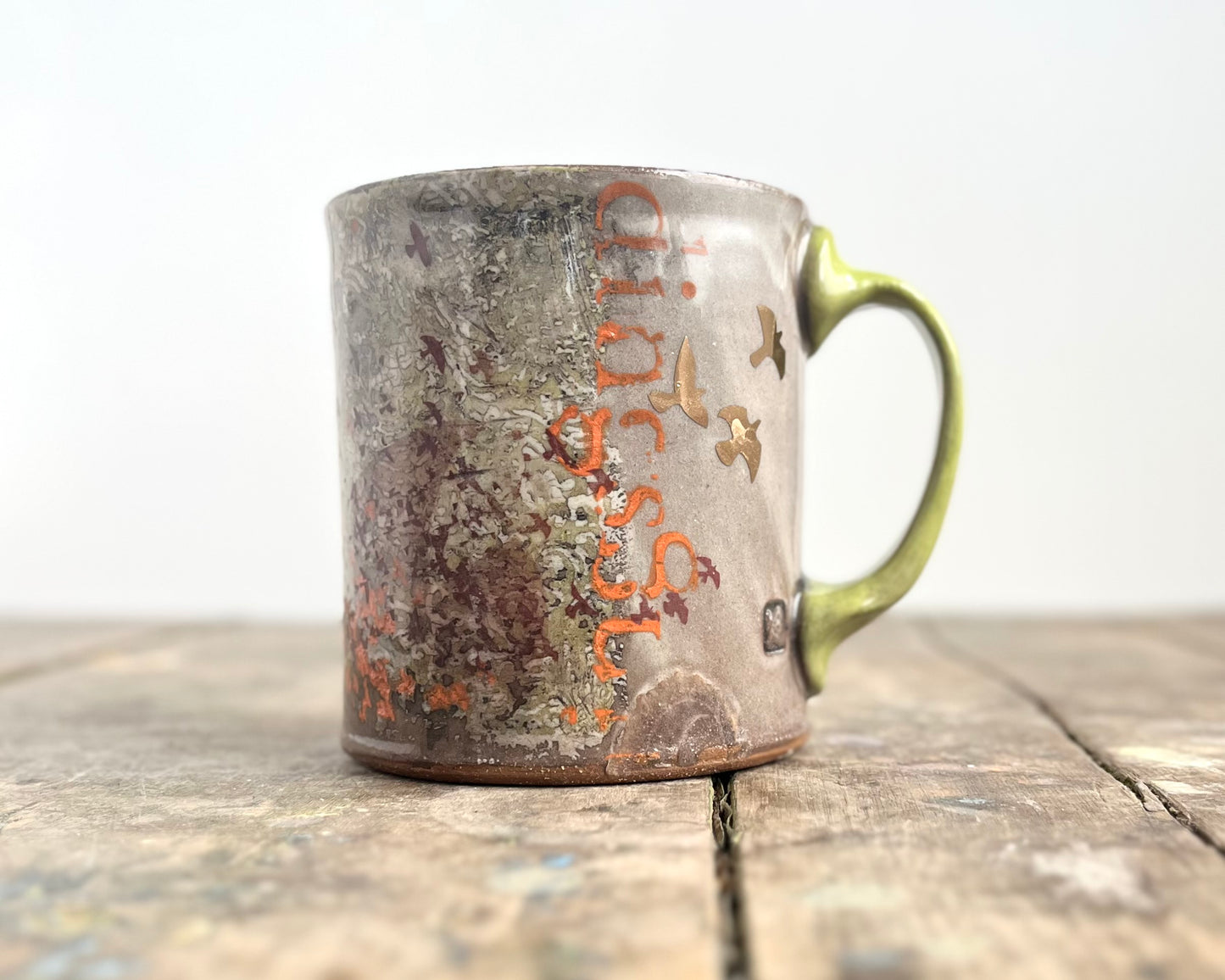 Mug with slip, gold decals and image transfer
