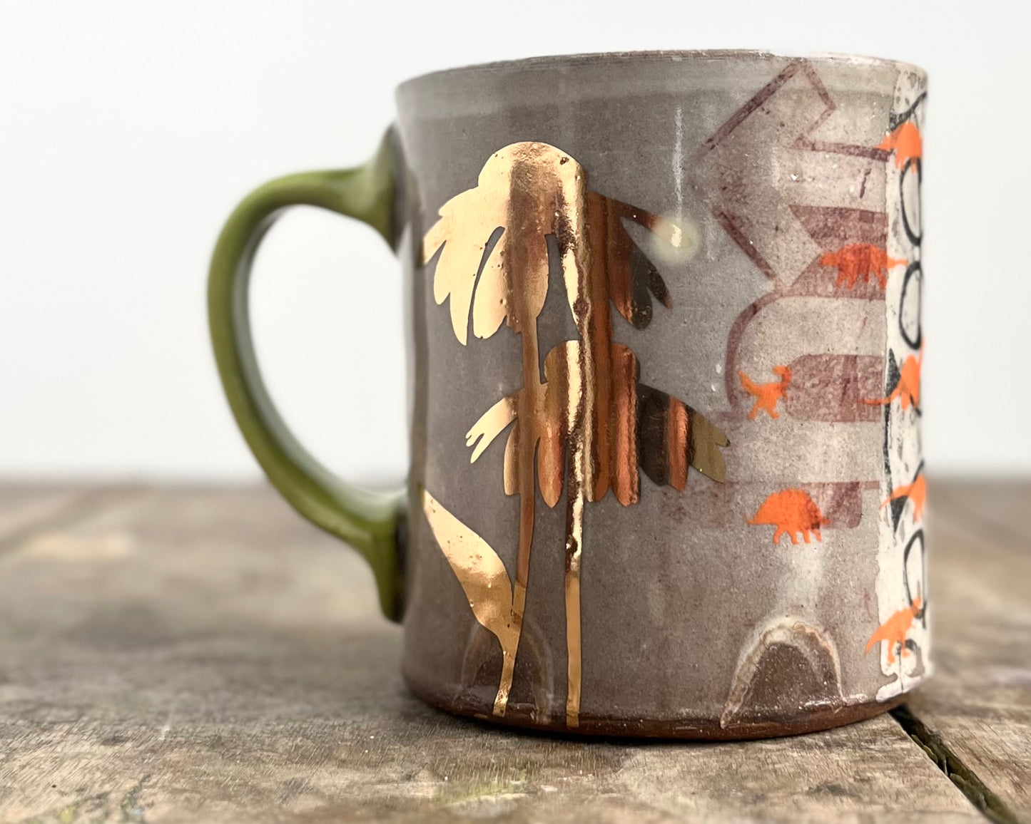 Mug with slip, gold decals and image transfer