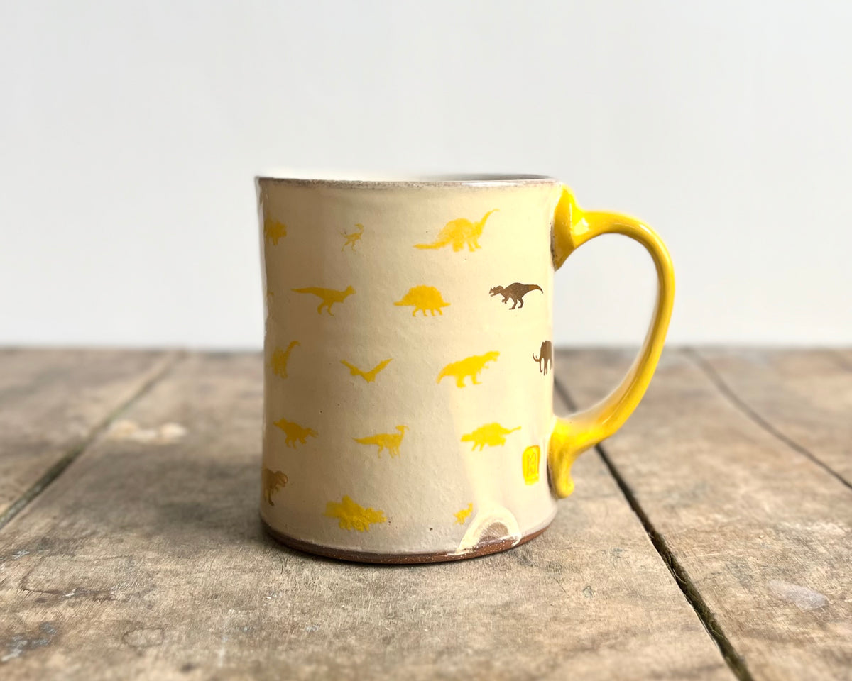 Mug with yellow handle, gold decals and image transfer