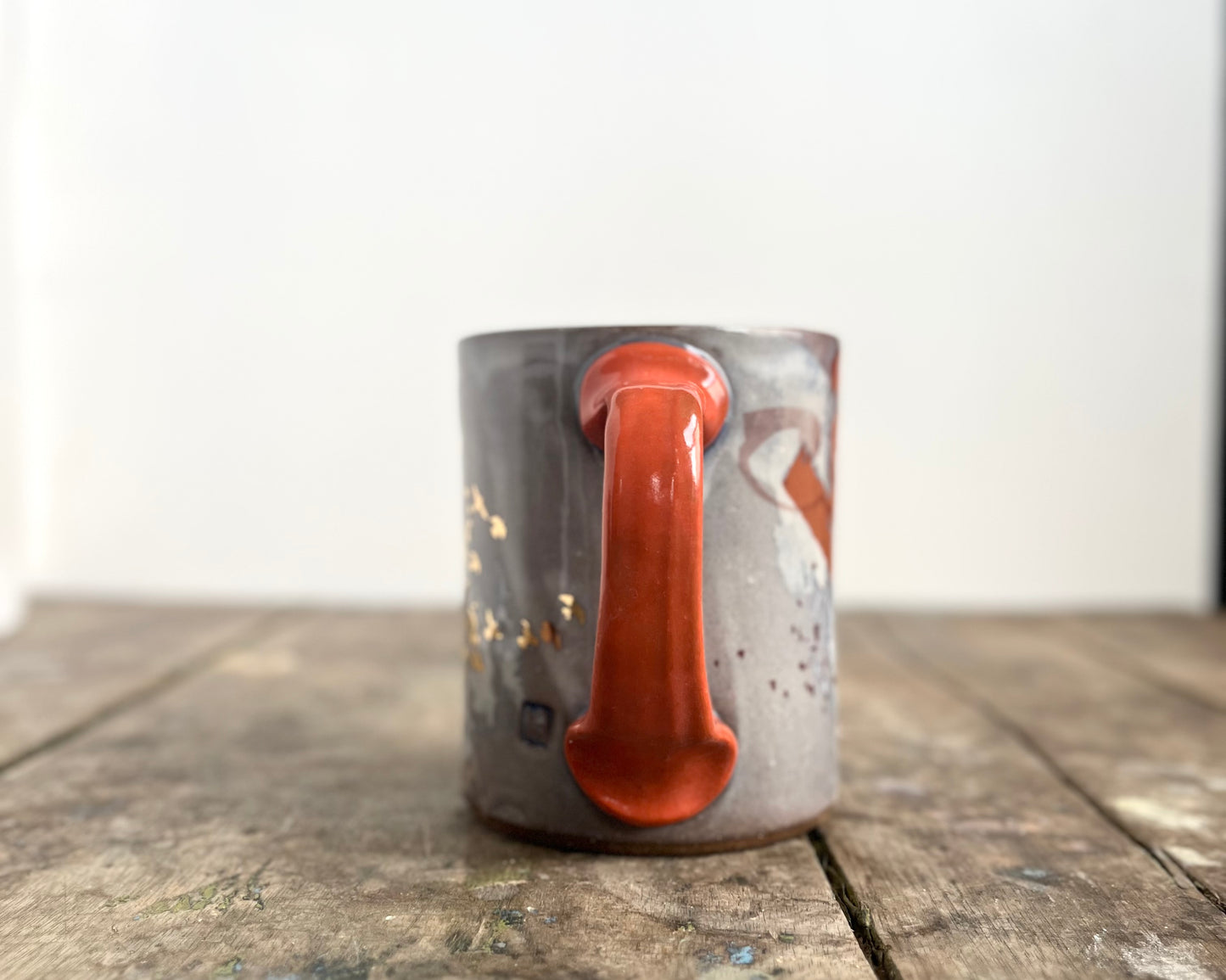 Mug with slip, gold decals and image transfer