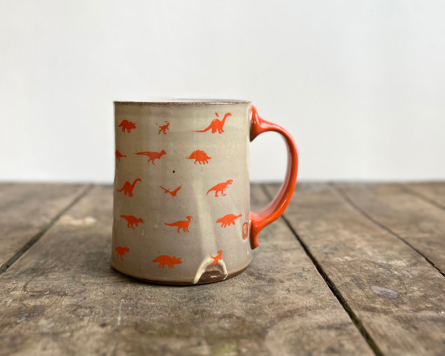 Mug with orange handle and image transfer