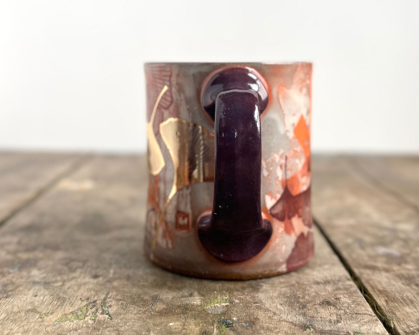 Mug with slip, gold decals and image transfer