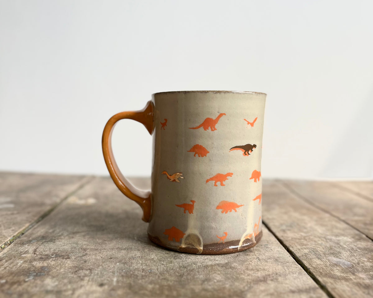 Mug with orange handle, gold decals and image transfer