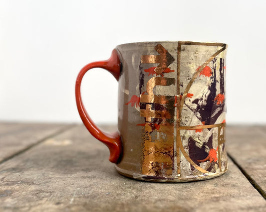 Mug with slip, gold decals and image transfer