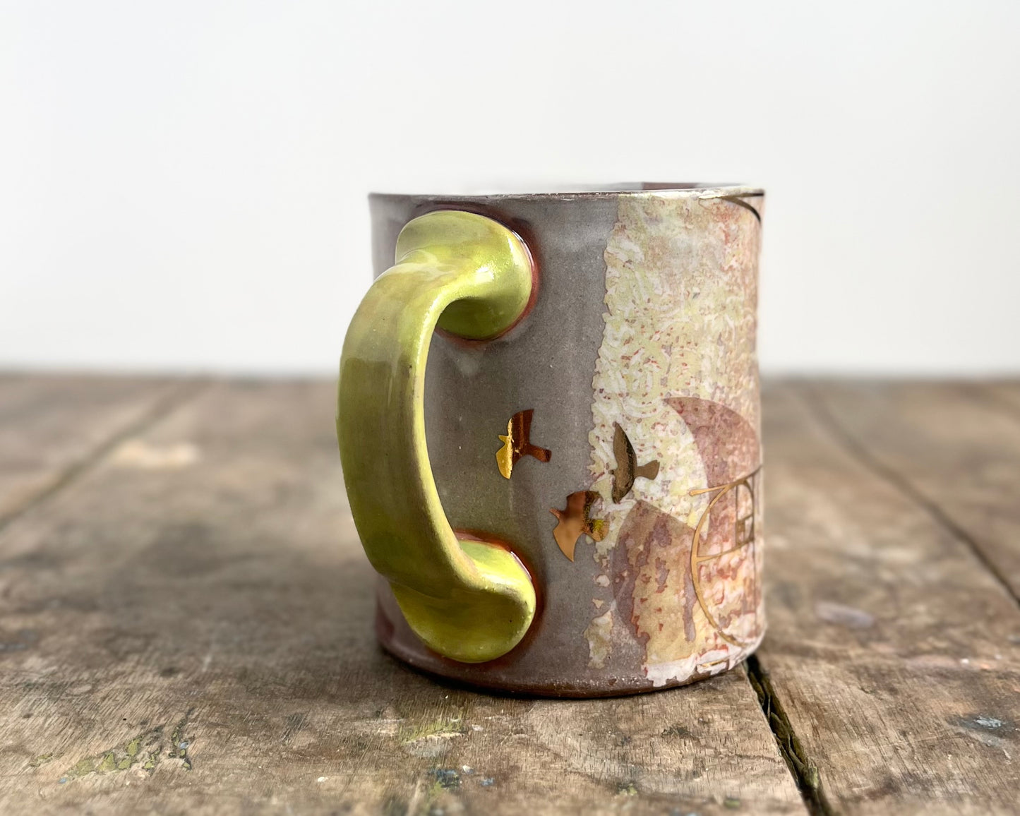 Mug with slip, gold decals and image transfer