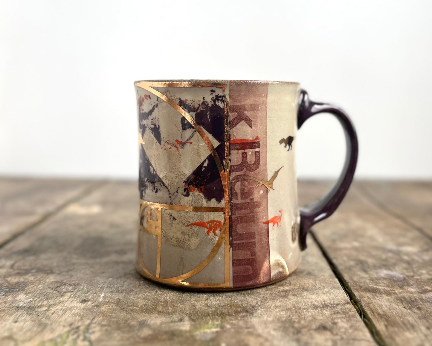 Mug with slip, gold decals and image transfer