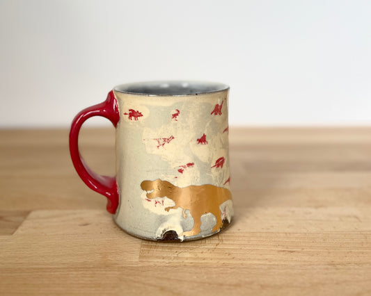 Mug with small red and gold dinos and gold T-Rex