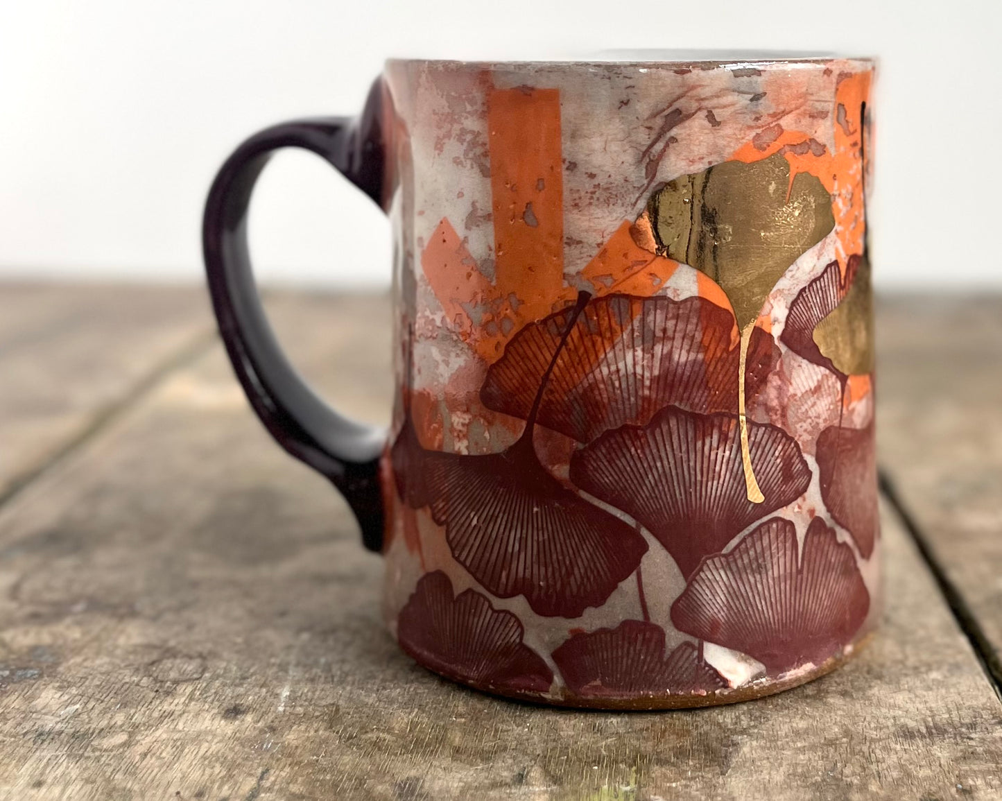 Mug with slip, gold decals and image transfer