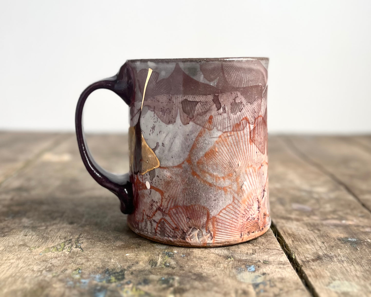 Mug with slip, gold decals and image transfer