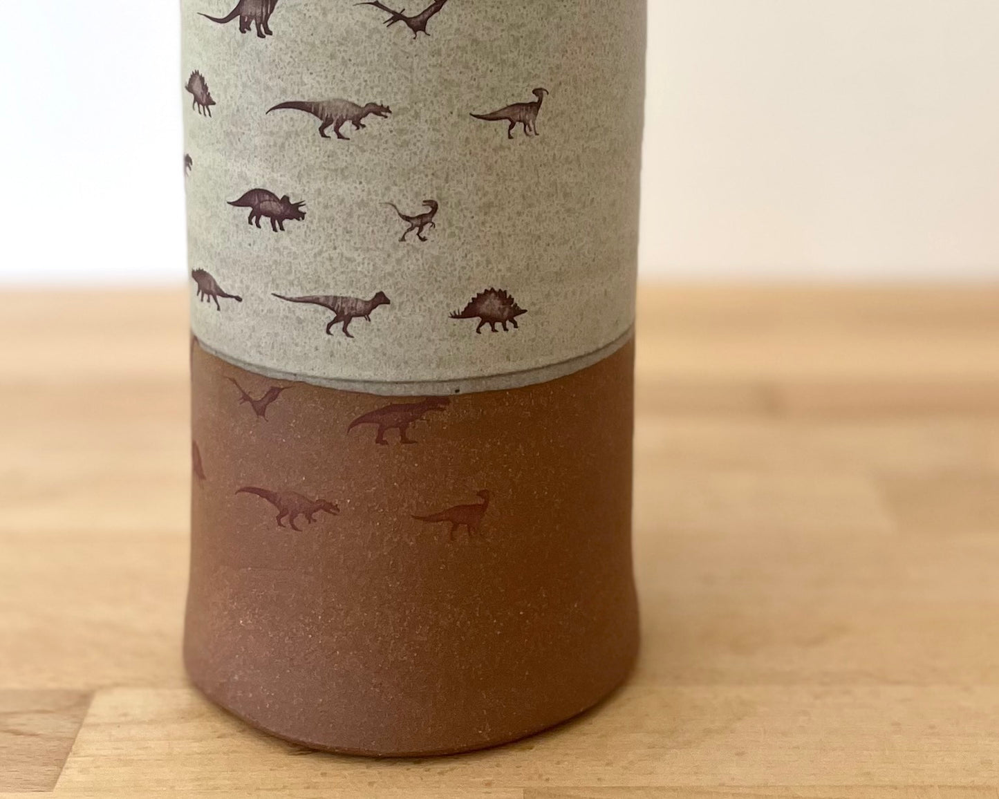 Cylindrical Vase with little dinosaurs - warm grey matte