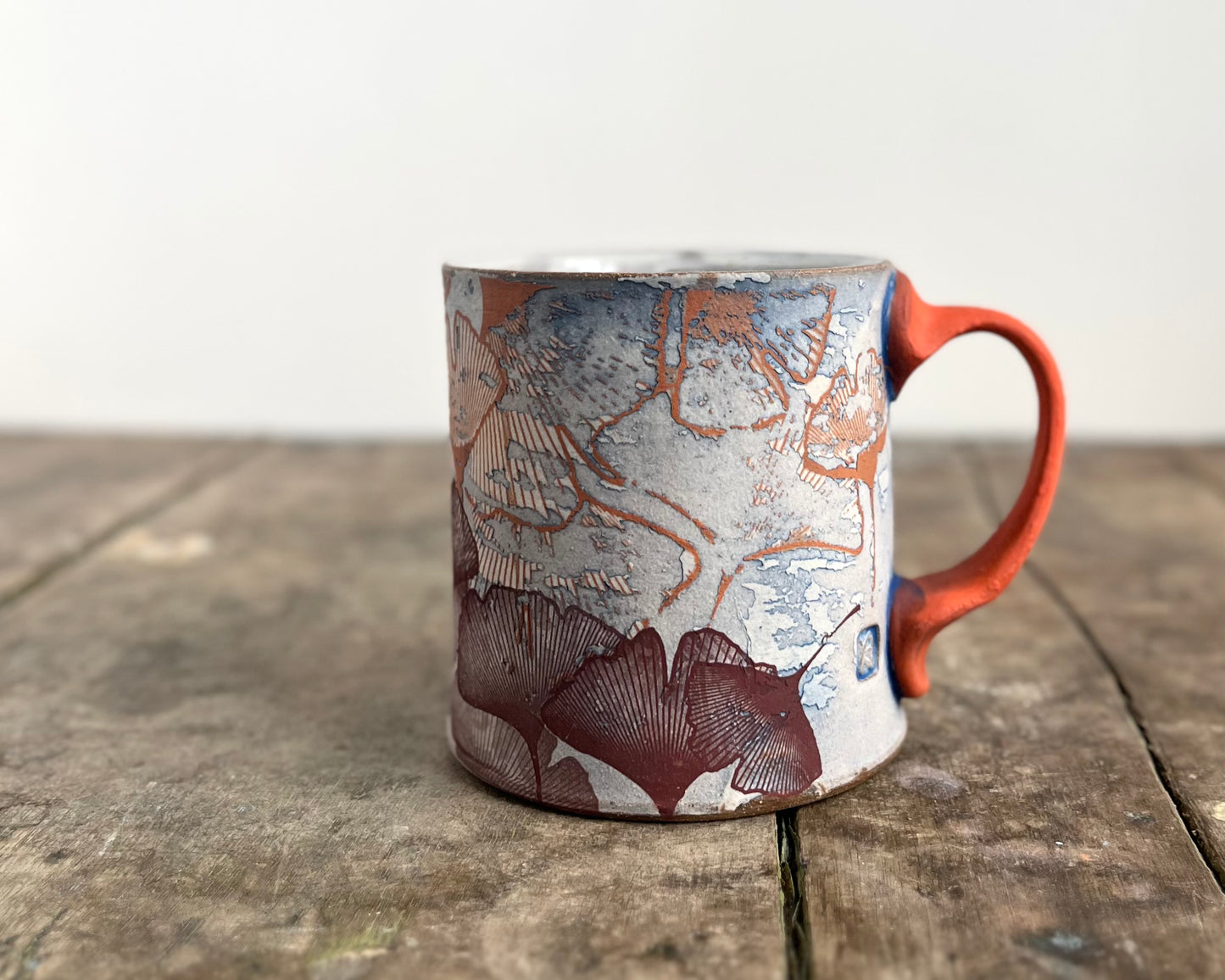 Mug with slip, gold decals and image transfer
