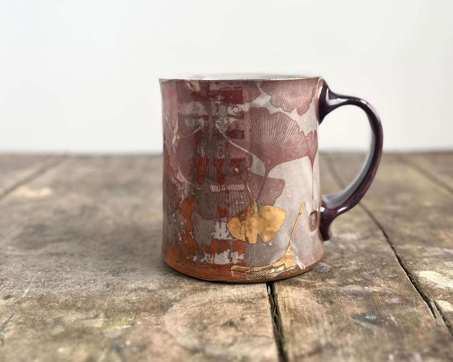 Mug with slip, gold decals and image transfer