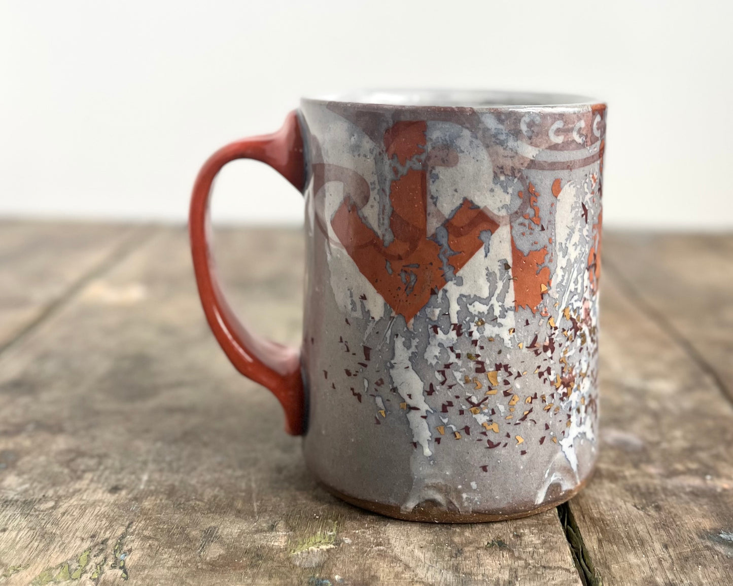 Mug with slip, gold decals and image transfer