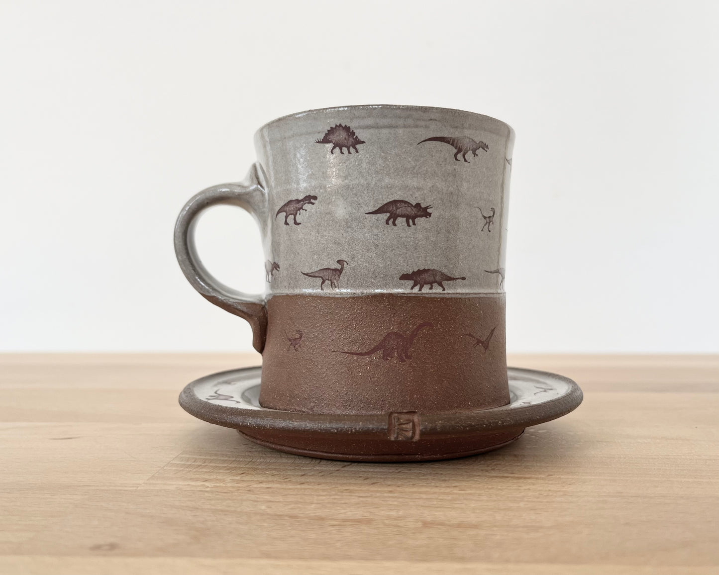 Americano Mug and Saucer with small dinosaurs- white