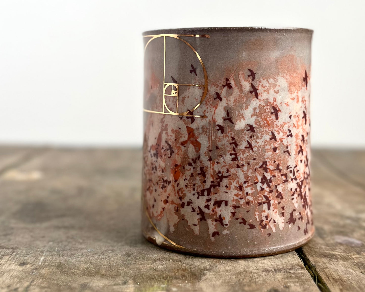 Mug with slip, gold decals and image transfer