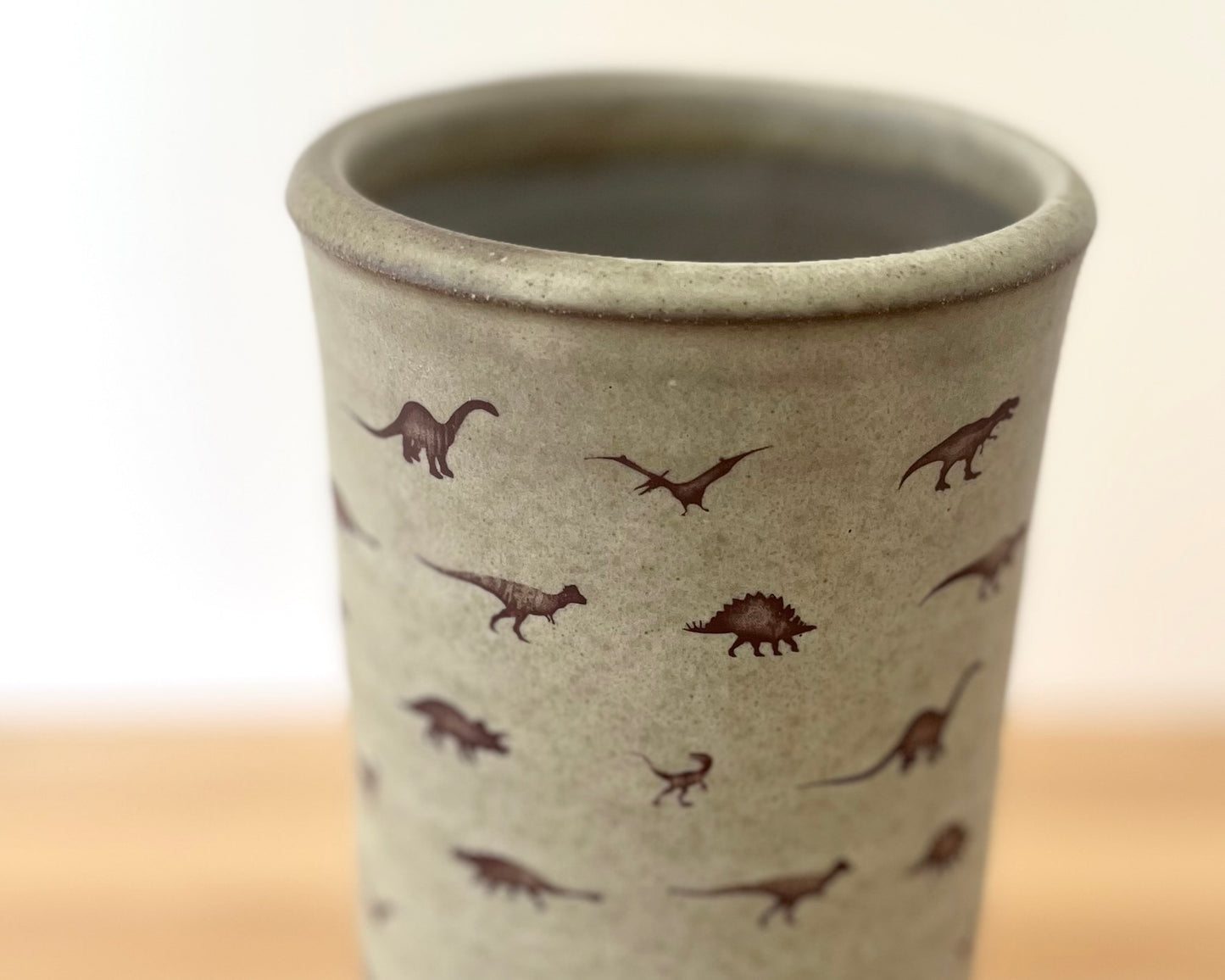 Cylindrical Vase with little dinosaurs - warm grey matte