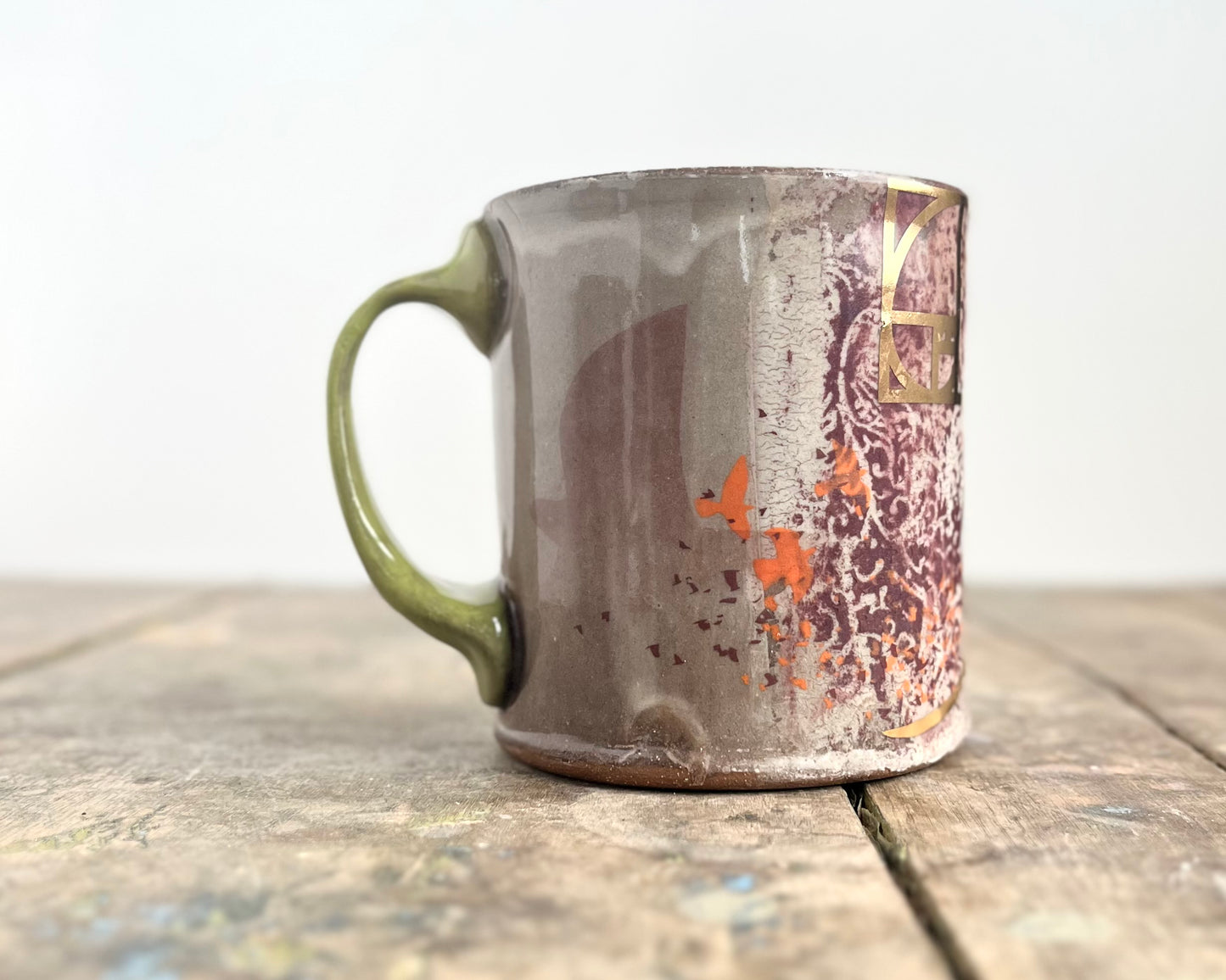 Mug with slip, gold decals and image transfer