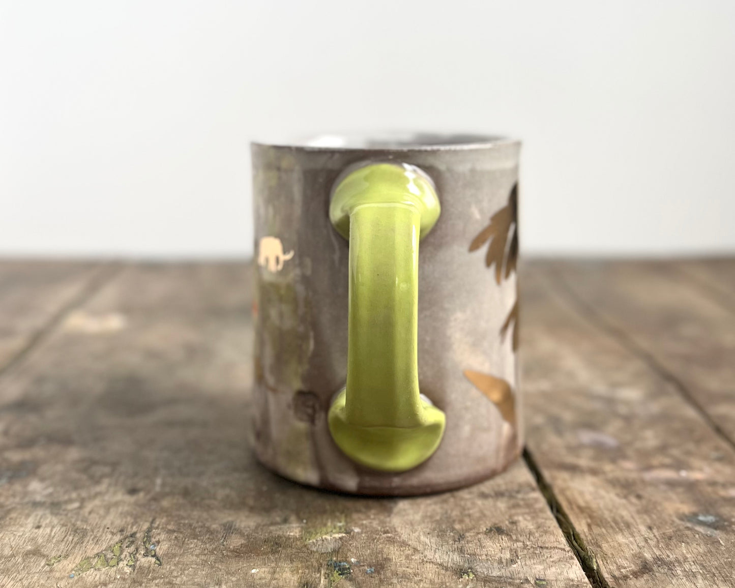 Mug with slip, gold decals and image transfer