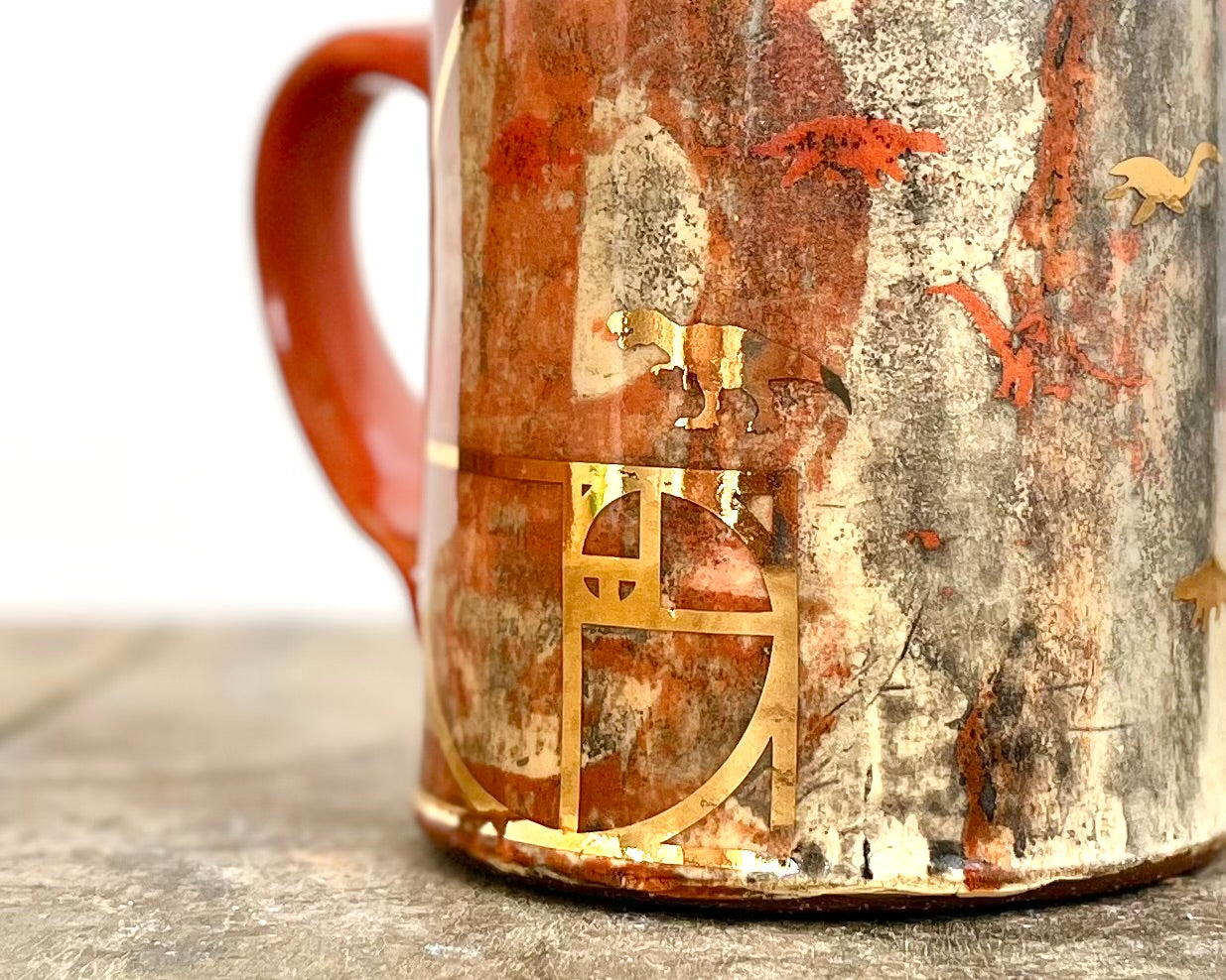 Mug with slip, gold decals and image transfer