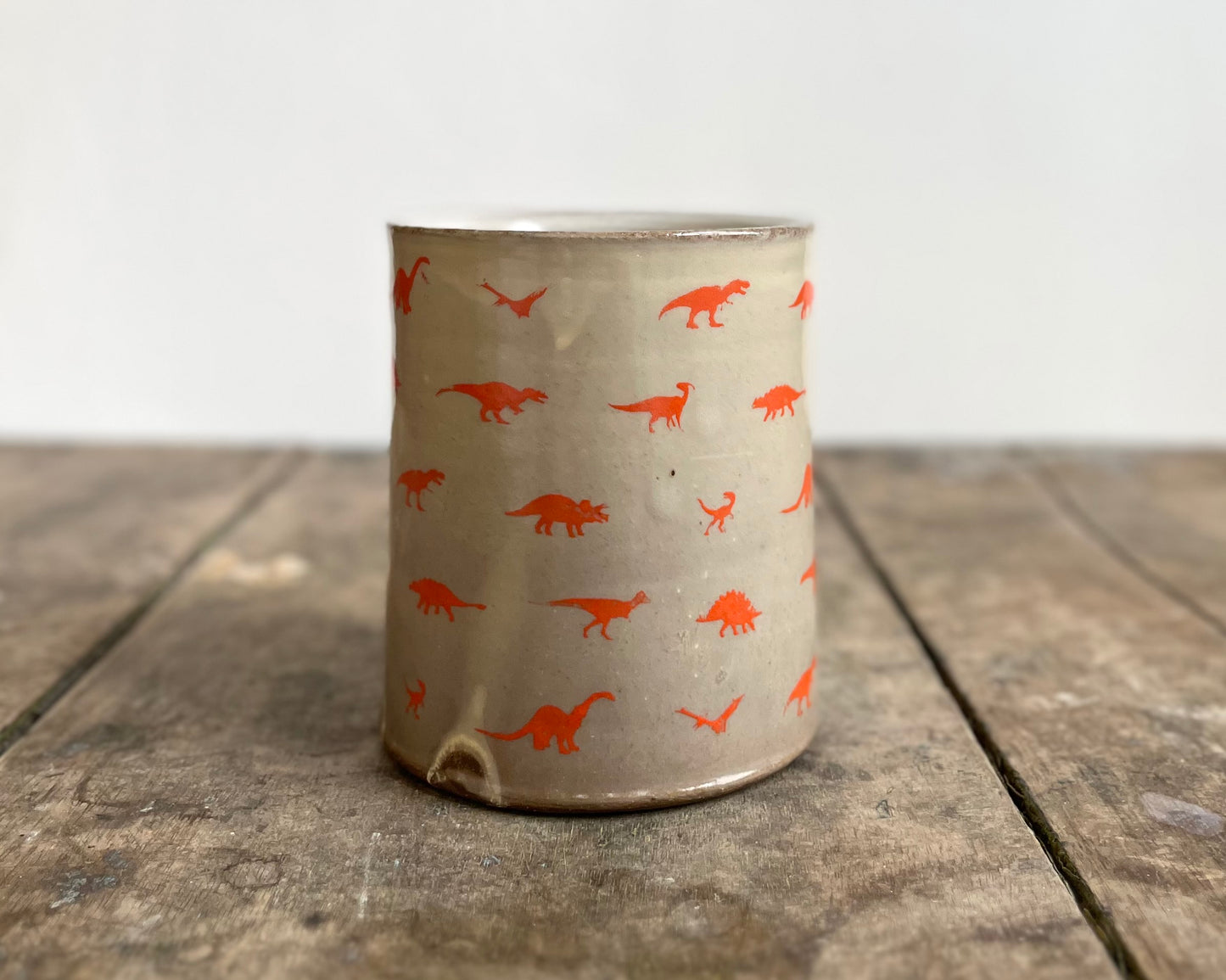 Mug with orange handle and image transfer