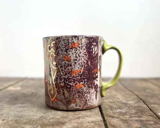 Mug with slip, gold decals and image transfer