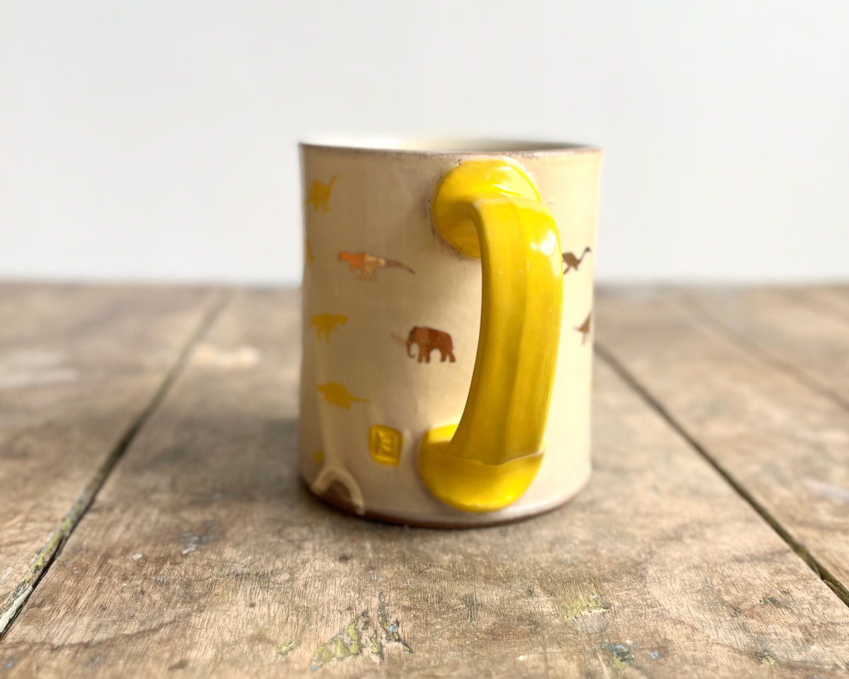 Mug with yellow handle, gold decals and image transfer