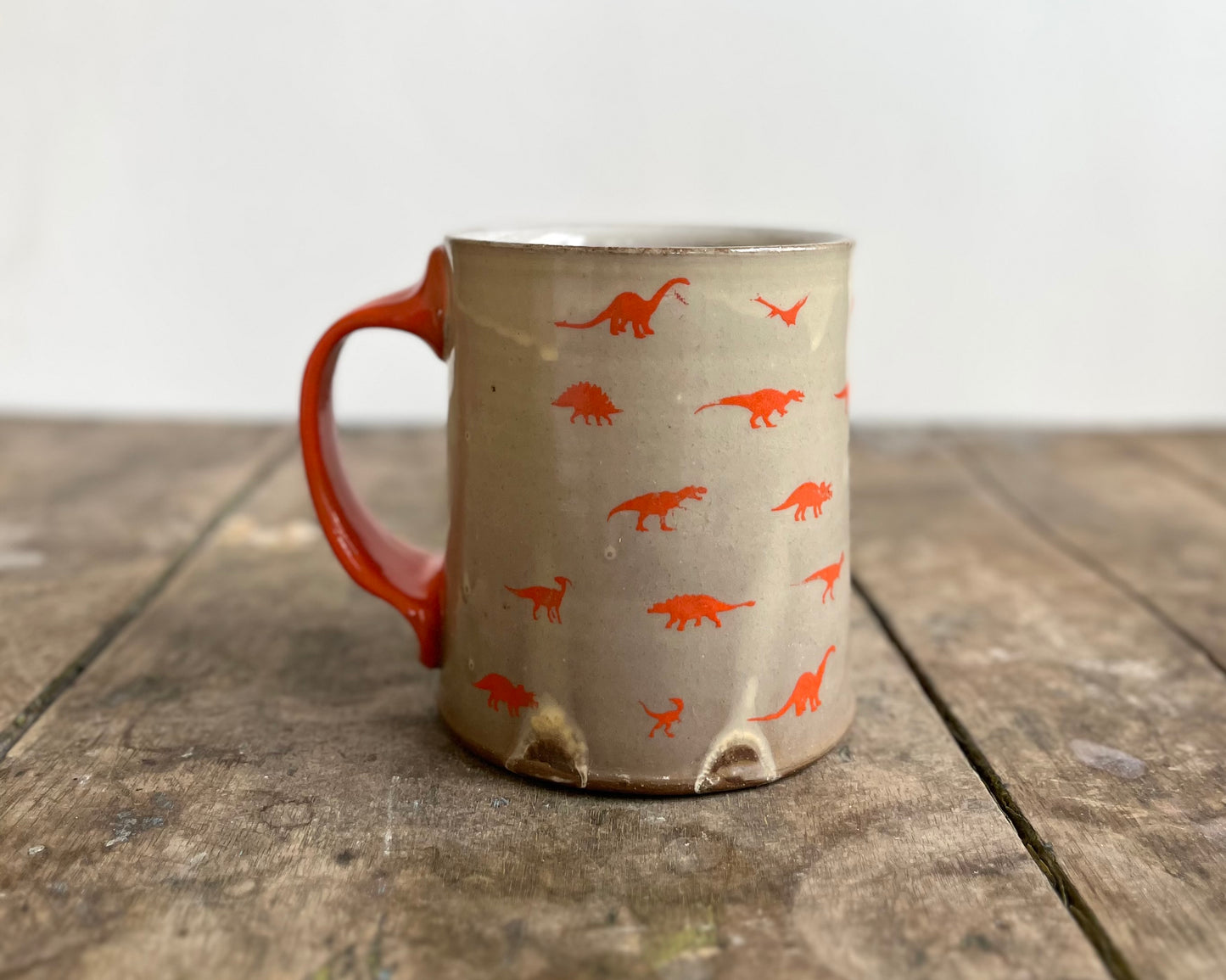 Mug with orange handle and image transfer