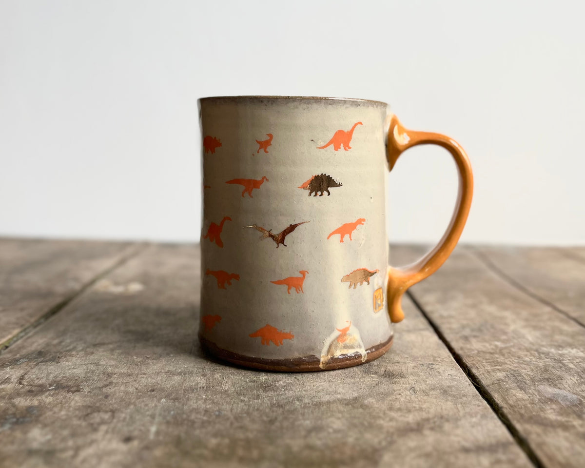 Mug with orange handle, gold decals and image transfer