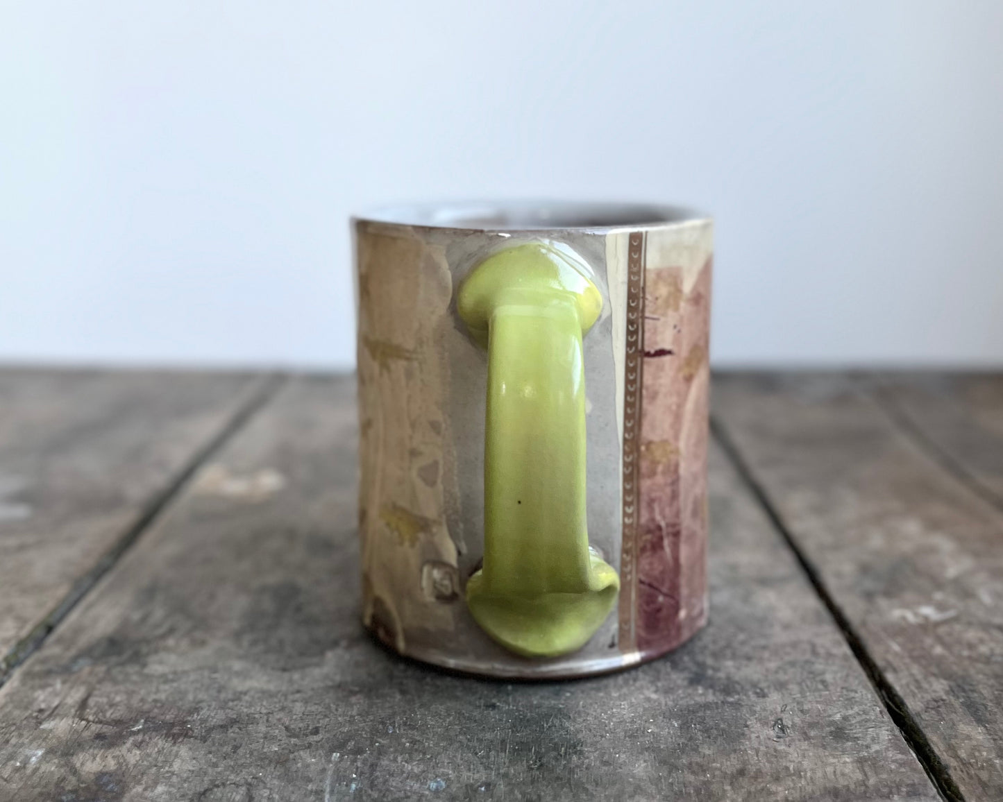 Mug with slip, gold decals and image transfer