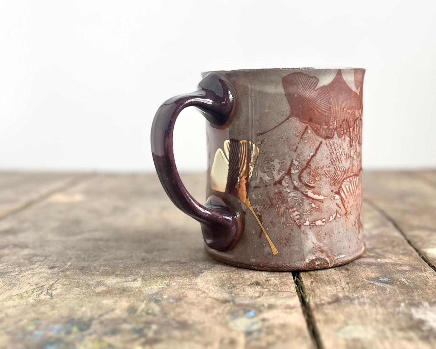 Mug with slip, gold decals and image transfer