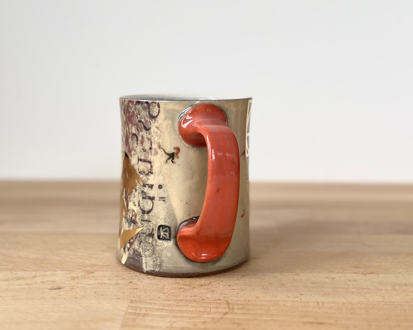 Mug with slip, gold decals and image transfer