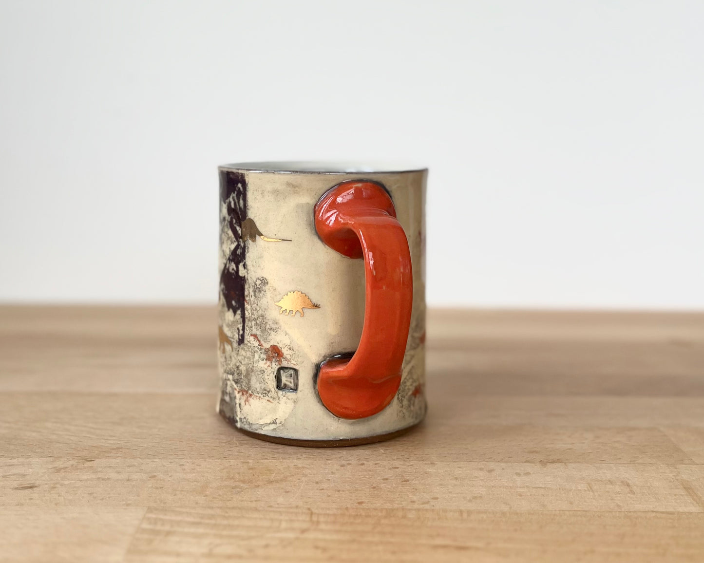 Mug with slip, gold decals and image transfer