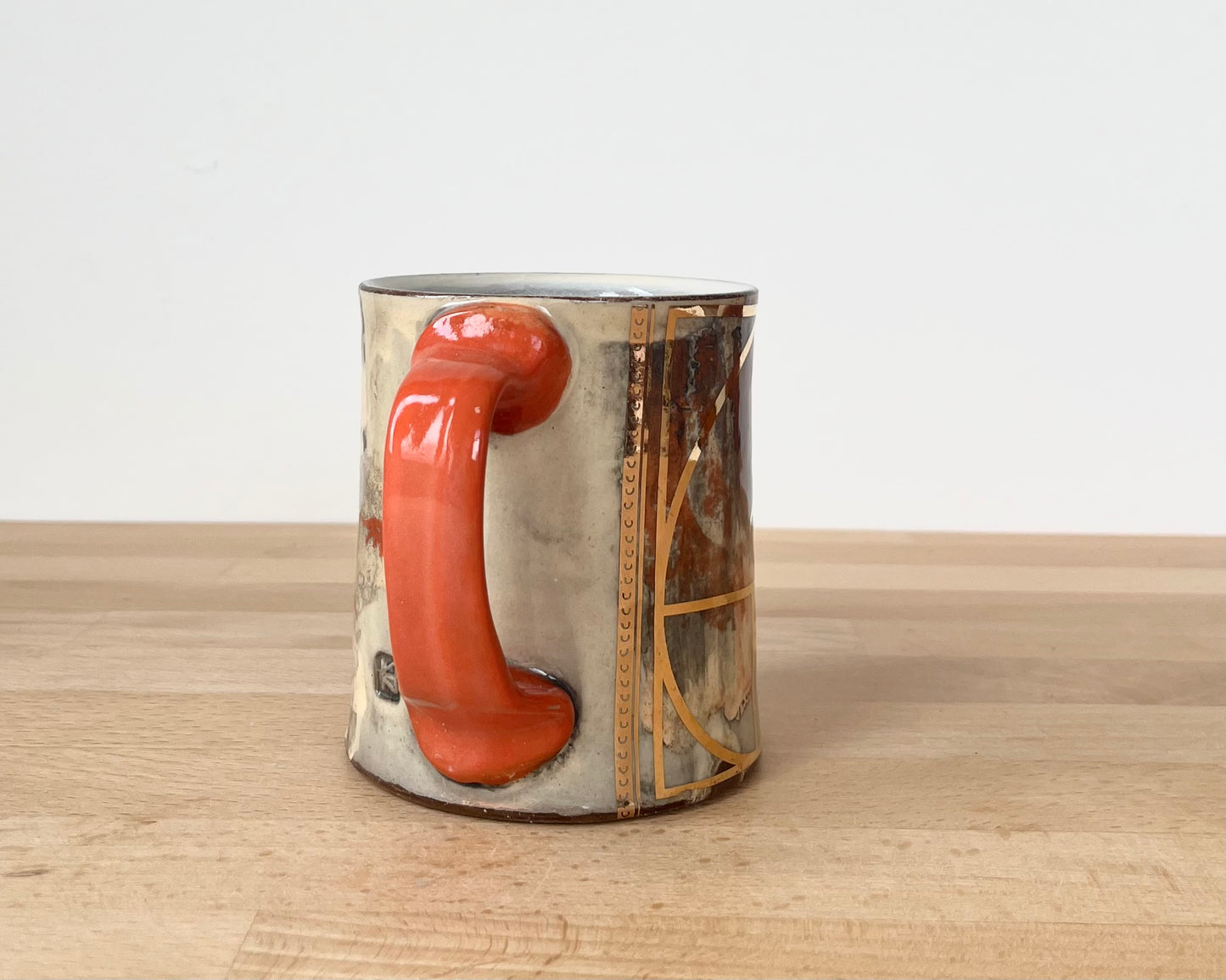 Mug with slip, gold decals and image transfer