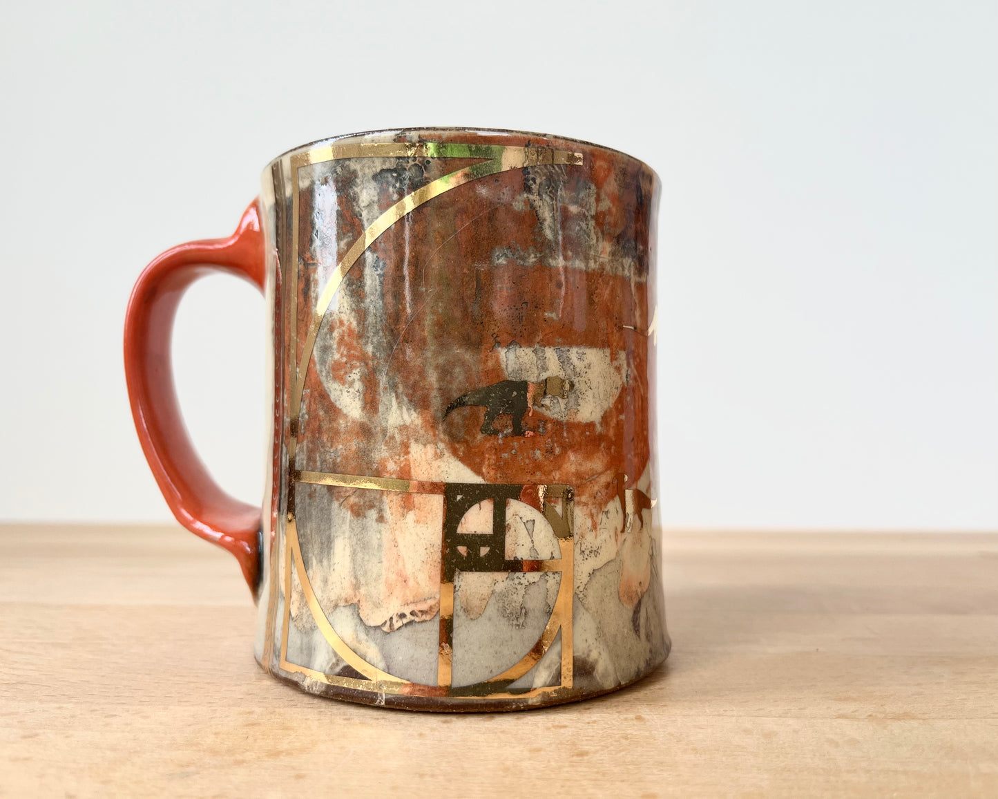 Mug with slip, gold decals and image transfer