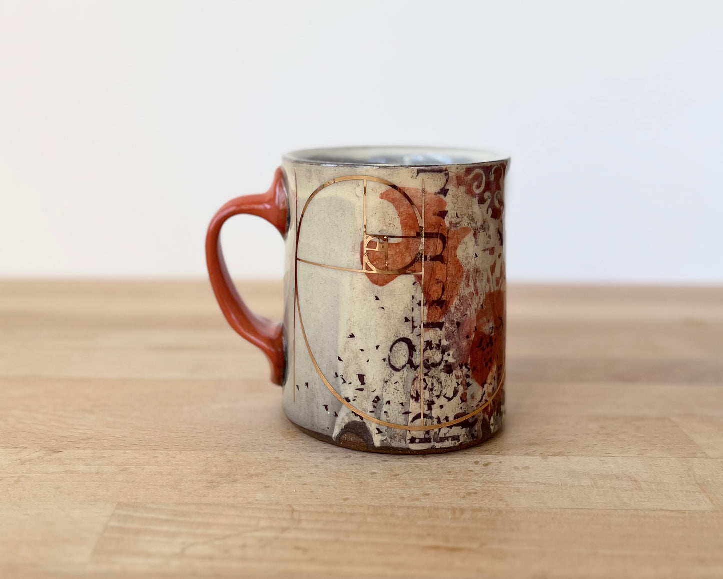Mug with slip, gold decals and image transfer