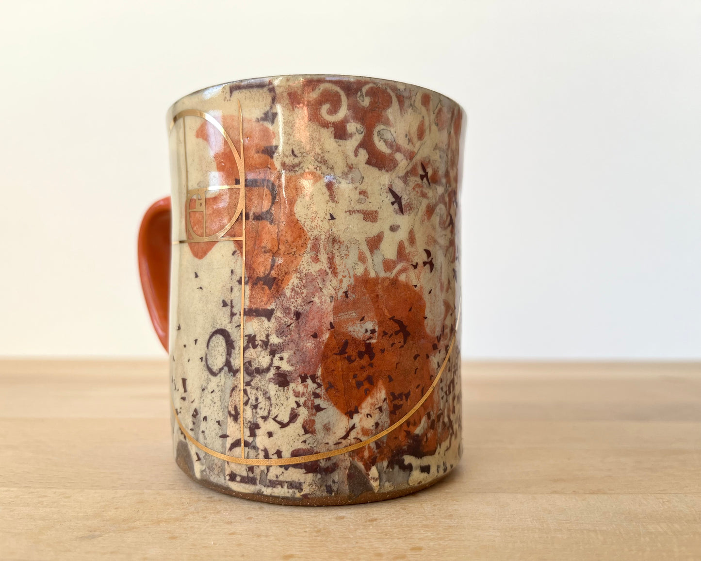 Mug with slip, gold decals and image transfer
