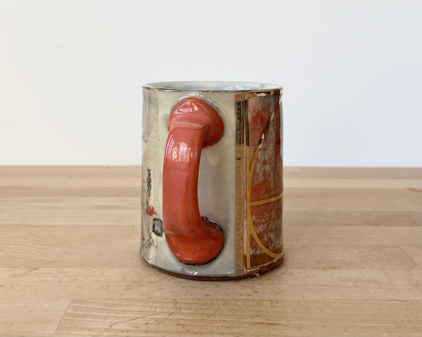 Mug with slip, gold decals and image transfer