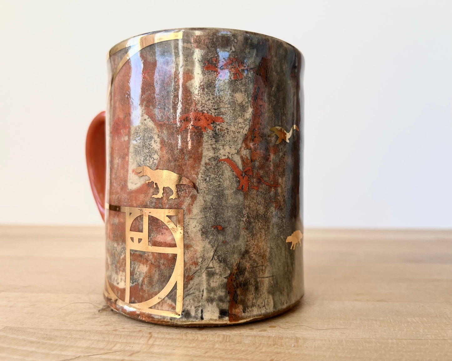 Mug with slip, gold decals and image transfer