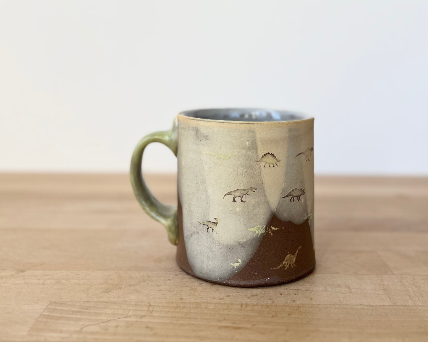 Mug with small light green dinos