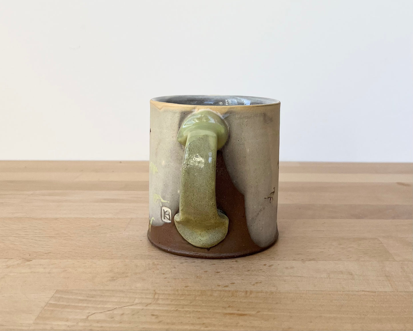Mug with small light green dinos