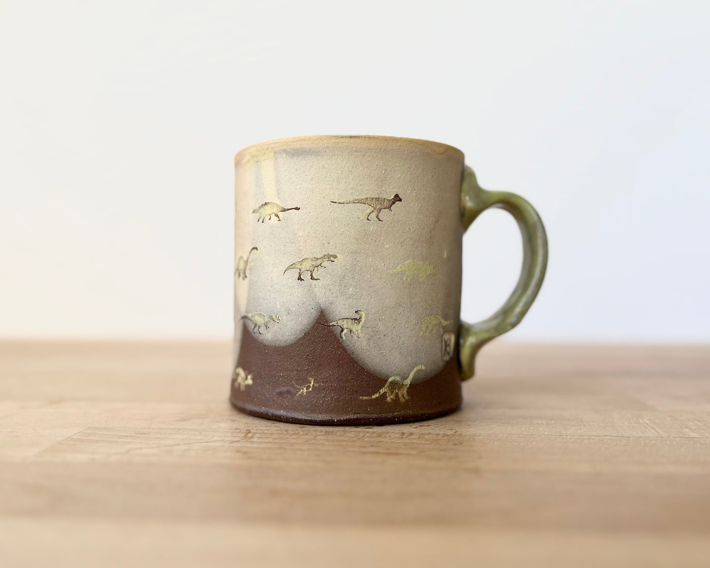 Mug with small light green dinos