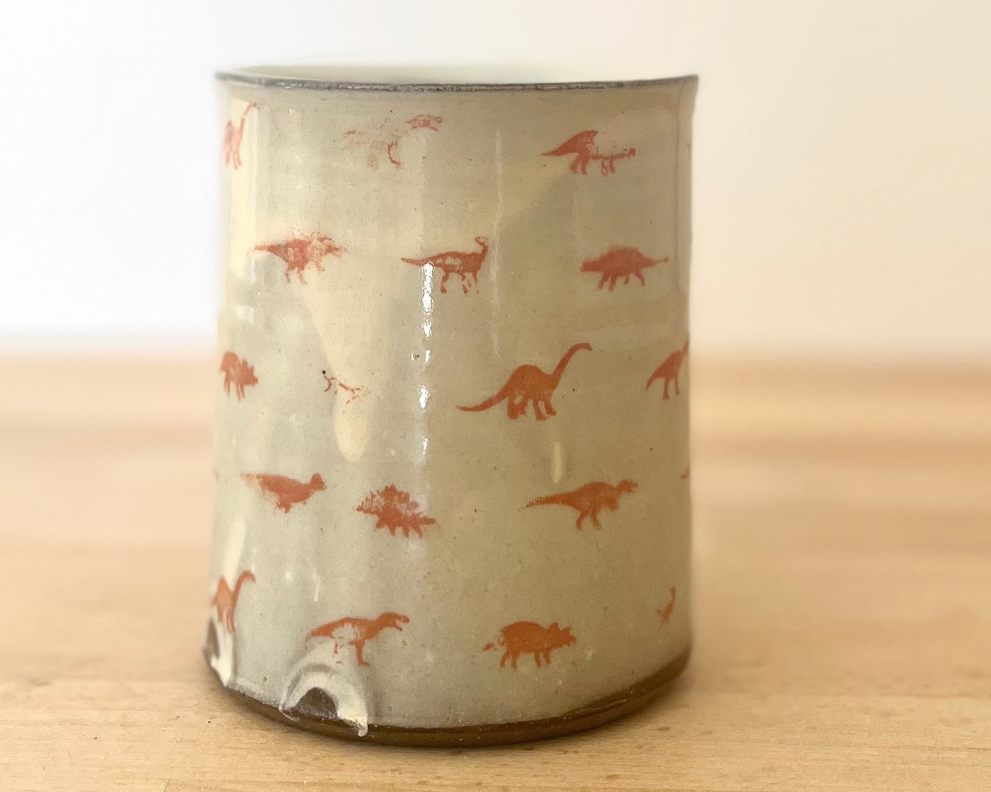 Mug with small orange dinos
