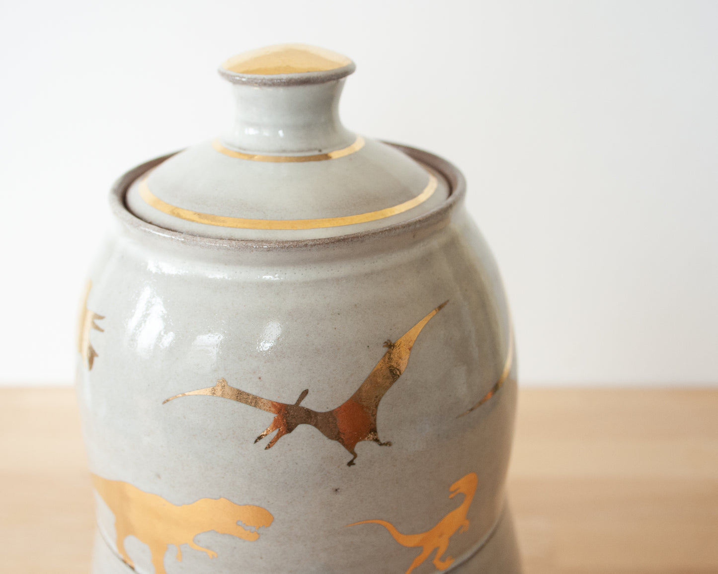 Lidded Jar with Gold Dinosaurs