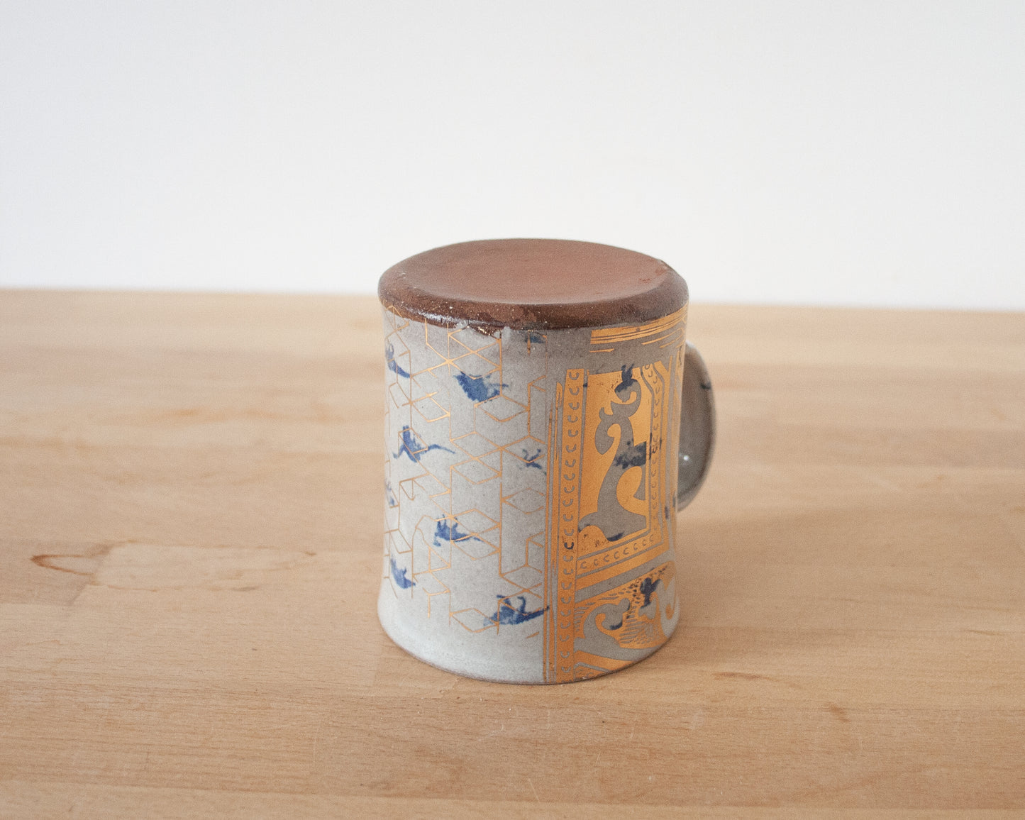 Gold T-Rex Mug with small blue dinos