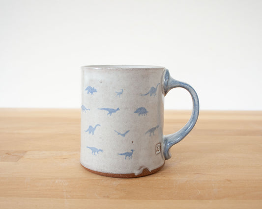 Mug with small blue dinosaurs